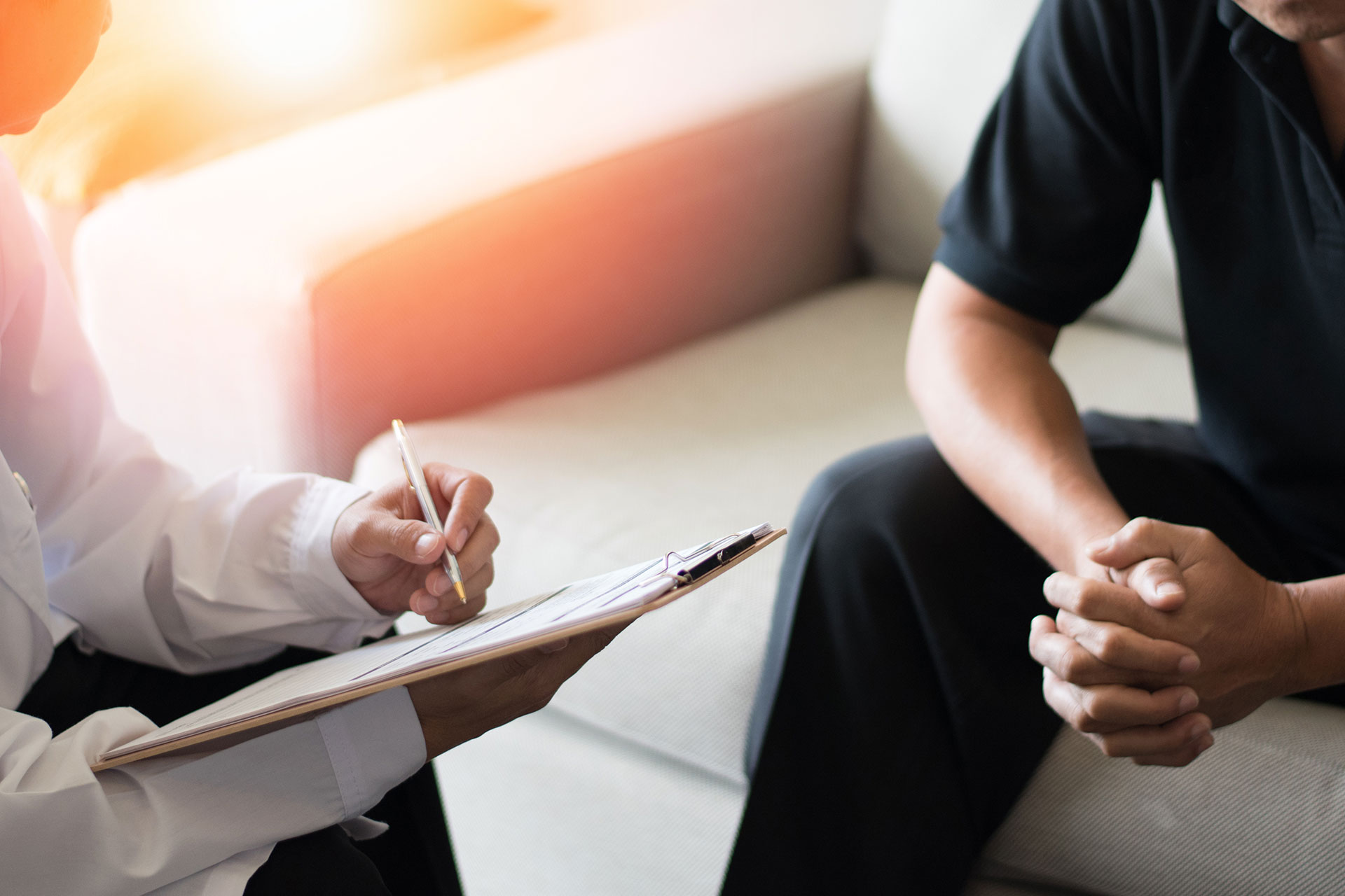 A doctor and patient in the office discussing erectile dysfunction.