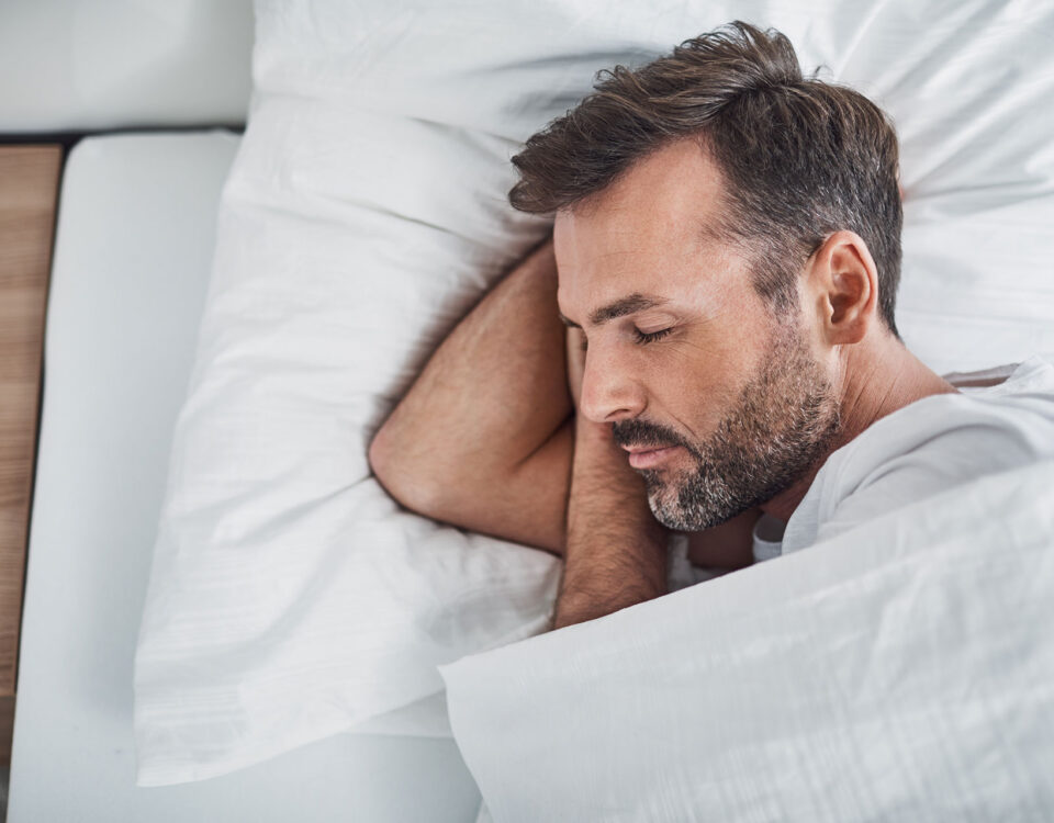 A man in bed sleeping