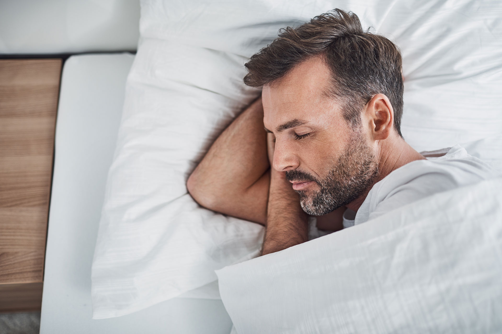 A man in bed sleeping