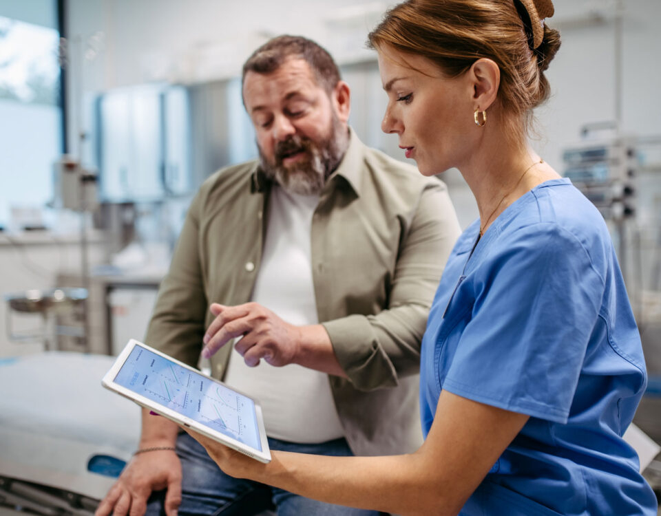 A man with his doctor discussing early vascular aging.