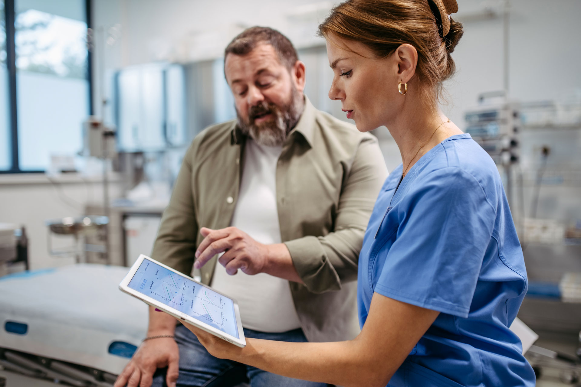 A man with his doctor discussing early vascular aging.