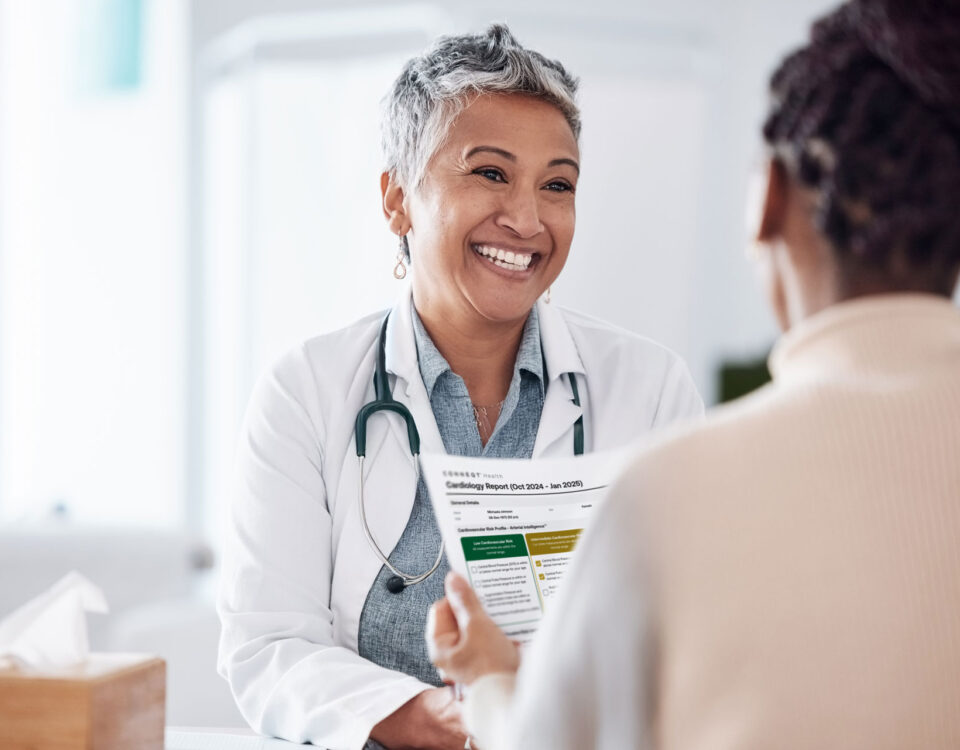 A doctor and patient reviewing health data together, showing how to talk to your doctor with more clarity and confidence.