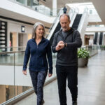 A couple discussing if 10,000 steps is enough for heart health.