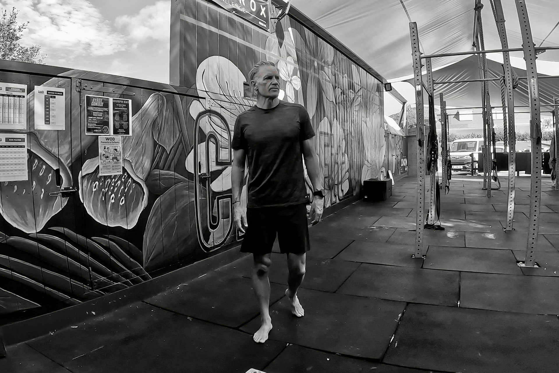 Craig Cooper, lean and fit at 63, walks barefoot through an open-air gym, the setting behind his account of how he lowered his ApoB.