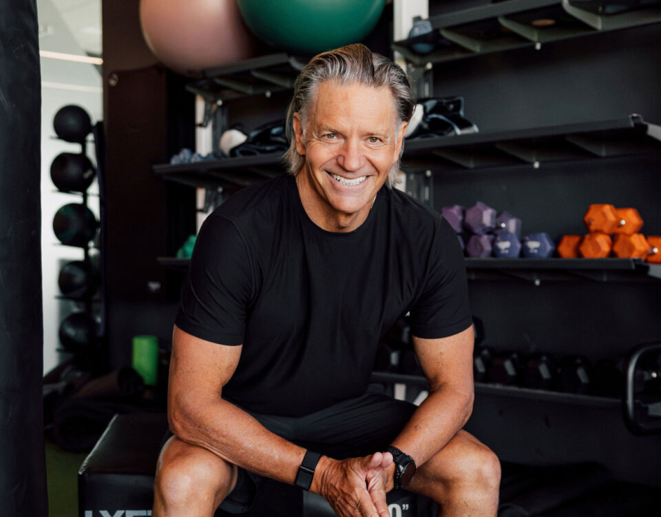 Craig Cooper, lean and fit at 63, walks barefoot through an open-air gym, the setting behind his account of how he lowered his ApoB.