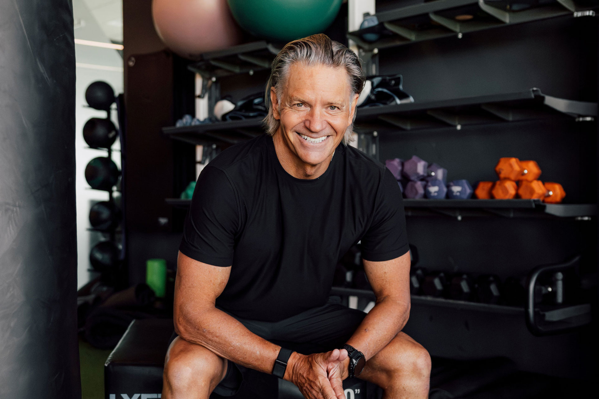 Craig Cooper, lean and fit at 63, walks barefoot through an open-air gym, the setting behind his account of how he lowered his ApoB.